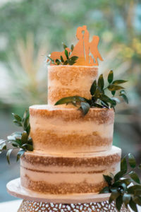 Rustic Semi Naked Three Tier Wedding Cake Decorated with Eucalyptus and Custom Wooden Cake Topper