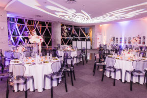 Downtown St. Pete Ivory and Blush Wedding Reception with Grey Ghost Chairs at Salvador Dali Museum | St. Pete Wedding Planner and Florist John Campbell Weddings | Catering by Olympia Catering | GOBO Light and Rentals by Gabro Event Services
