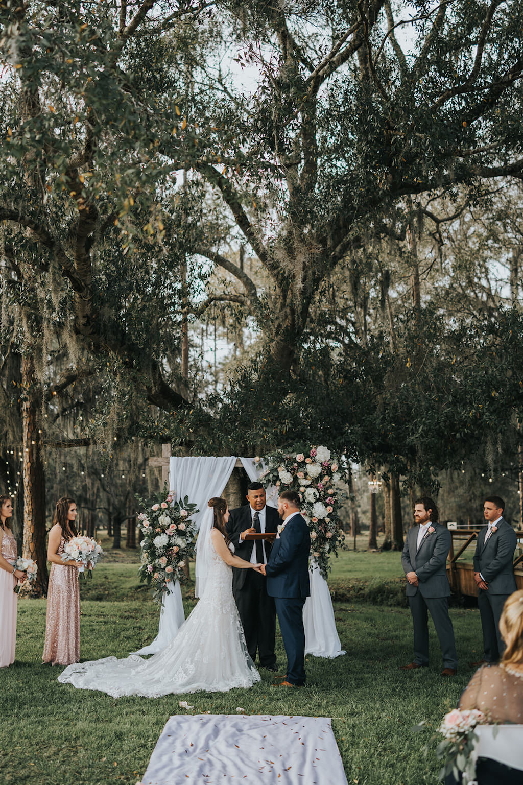 Rustic Chic Bride and Groom Exchanging Vows Under Trees Wedding Ceremony Portrait | Tampa Wedding Venue Rafter J Ranch | Wedding Planner Kelly Kennedy Weddings and Events