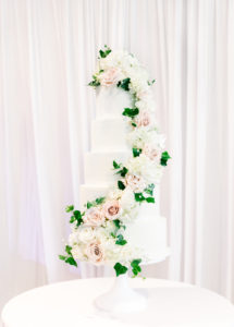 Elegant Classic Six Tier Round White Wedding Cake with Cascading White Hydrangeas, Blush Pink Roses and Greenery Leaves | Tampa Wedding Baker The Artistic Whisk