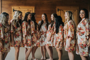 Tampa Bay Bride and Bridesmaids in Matching Floral Silk Robes Getting Ready Wedding Portrait