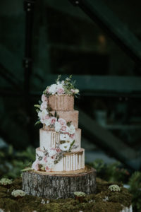 Unique Whimsical Garden Inspired White, Blush Pink and Gold Ombre Tiered Wedding Cake with Gold Drip Accent, Cascading Blush Pink and White Florals on Natural Edged Tree Round Cake Stand with Moss | St Pete Wedding Cake Bakery The Artistic Whisk | Tampa Bay Wedding Planner UNIQUE Weddings + Events