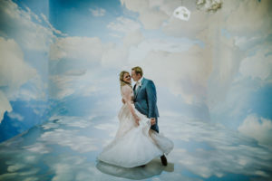 Whimsical Fun and Creative Bride and Groom Wedding Portrait in Artsy Cloud Room | Downtown St. Pete Wedding Venue Salvador Dali Museum