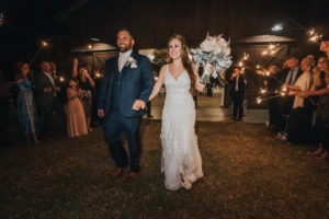 Rustic Chic Florida Bride and Groom Wedding Reception Sparkler Exit | Tampa Wedding Venue Rafter J Ranch | Wedding Planner Kelly Kennedy Weddings and Events
