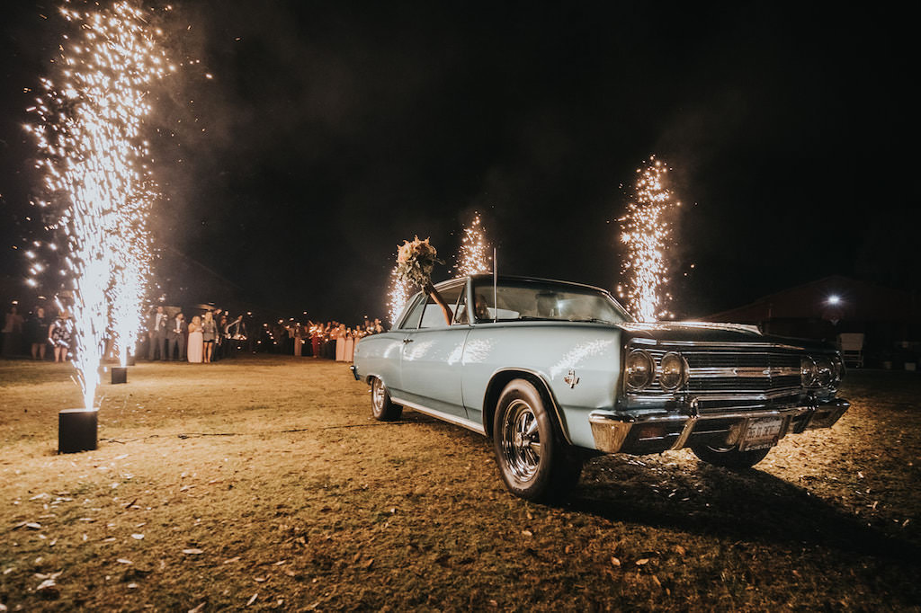 Florida Bride and Groom in Vintage Car Wedding Exit with Tall Sparklers | Tampa Wedding Planner Kelly Kennedy Weddings and Events