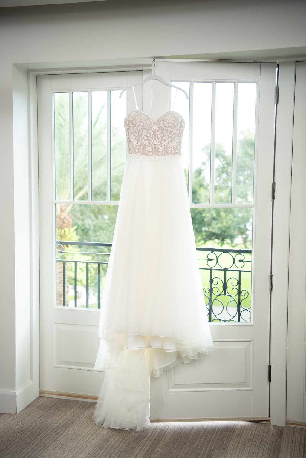 Romantic, White Strapless A-Line Sweetheart Wedding Dress by Designer Justin Alexander, Detailed Fitted Floral Embellished Bodice with Tulle Skirt | St. Pete Boutique Hotel and Modern Wedding Venue The Birchwood