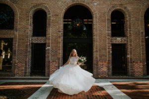 Tampa Bay Bride Twirling in High Neck Halter Lace and Illusion Wedding Dress