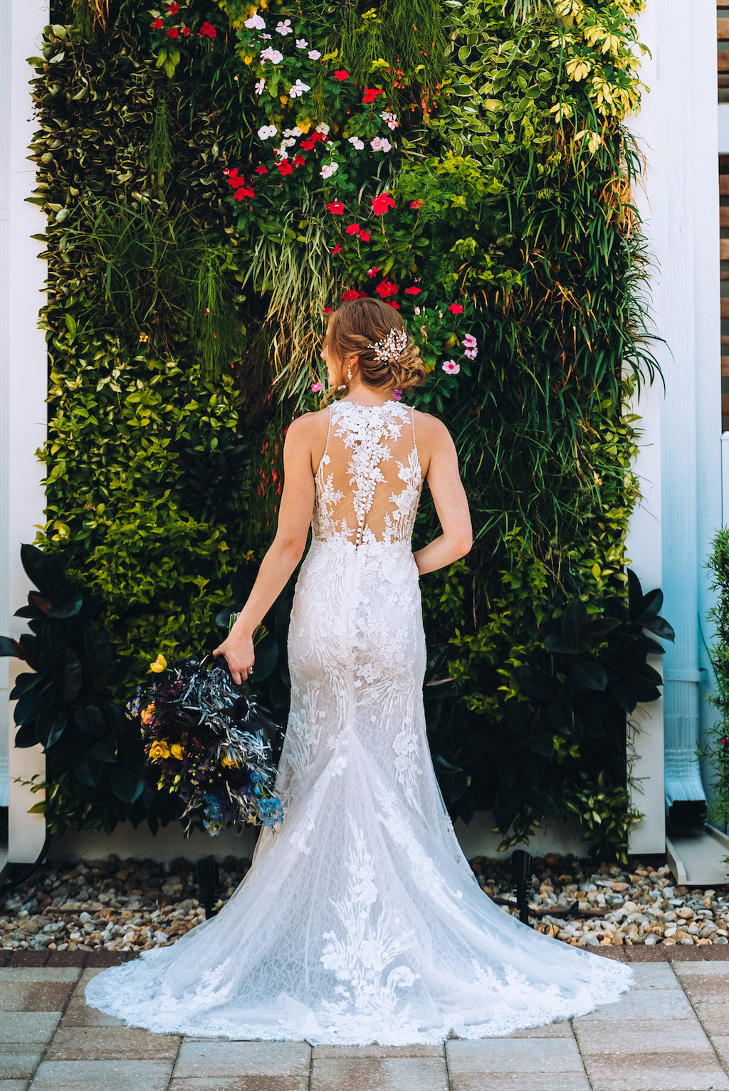Tampa Bay Bride Outdoor Garden Wedding Portrait in Lace and Illusion Back with Buttons Fitted Silhouette Wedding Dress with Dark Colored Bridal Floral Bouquet | Wedding Attire Truly Forever Bridal | Wedding Hair and Makeup Michele Renee the Studio | Wedding Planner Special Moments Event Planning | Styled Shoot