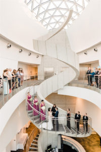 Florida Bride and Groom Exchanging Wedding Ceremony Vows on White Spiral Staircase at Unique St. Petersburg Salvador Dali Museum Venue