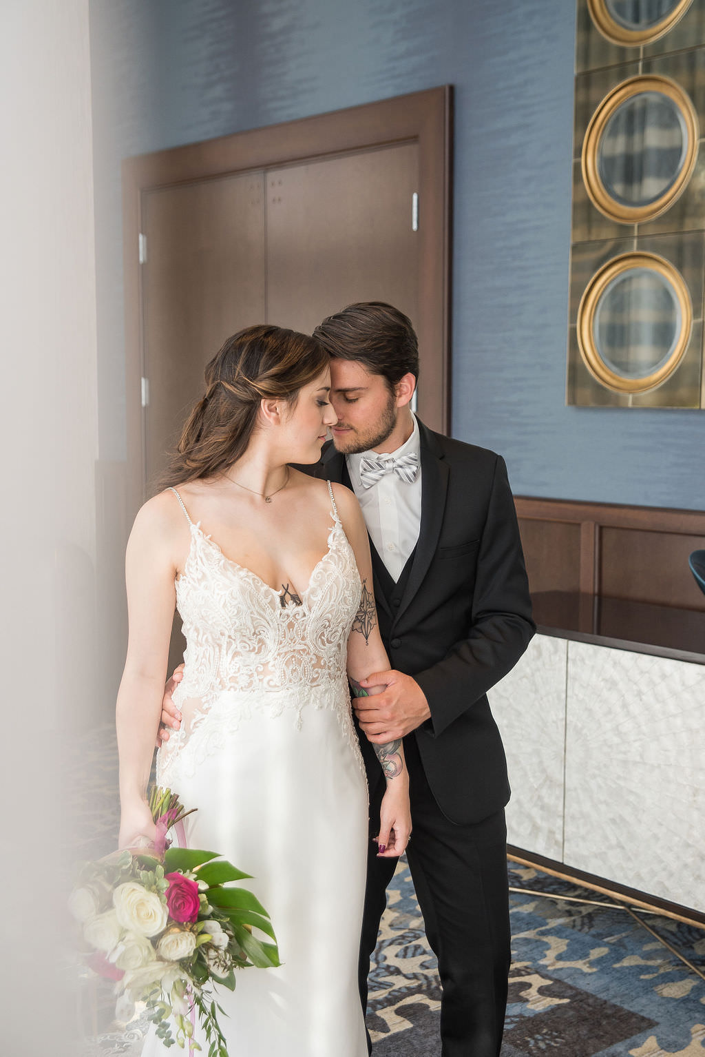 Florida Bride in Low V Neckline Lace and Illusion Spaghetti Strap Wedding Dress and Groom in Black Tuxedo | Wedding Portrait | Tampa Bay Wedding Photographer Kristen Marie Photography | Hotel Wedding Venue Hyatt Place Downtown St. Pete | Wedding Florist Brides N Blooms | Wedding Attire Nikki's Glitz and Glam Boutique