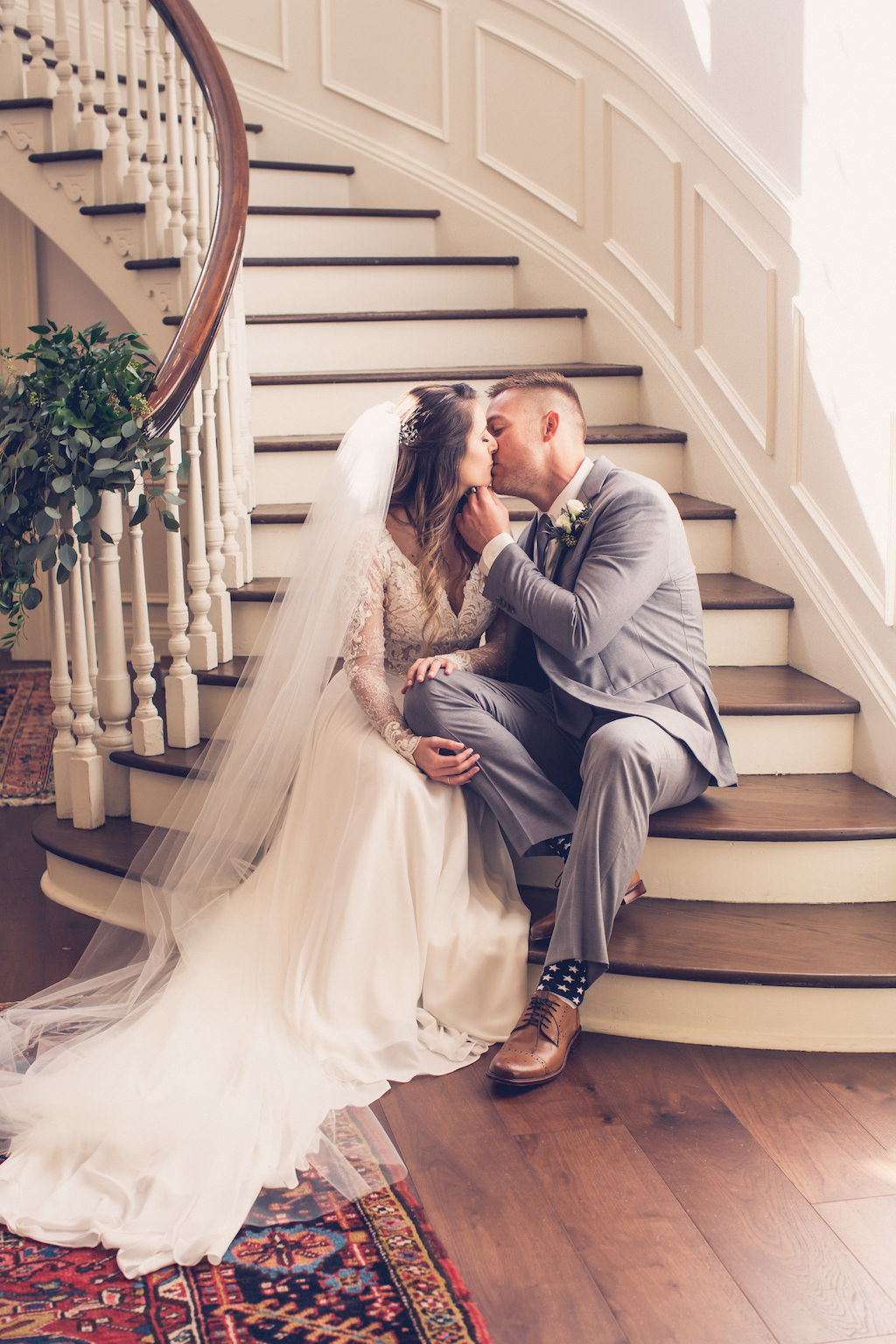 Simple Chic Romantic, South Tampa Bride and Groom Wedding Portrait on Staircase, Bride with Cathedral Length Veil | Wedding Venue Tampa Yacht Club | Florida Luxury Wedding Photographer Luxe Light Images