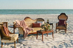 Outdoor Beachfront Reception Seating Area with Vintage Wooden Furniture | Resort at Longboat Key Club