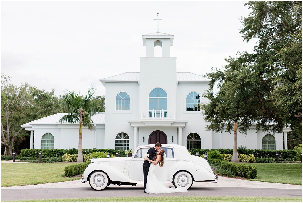 Bride And Groom Exit | Classic Vintage Car | Vintage Glam Tampa Safety Harbor Wedding Venue Harborside Chapel
