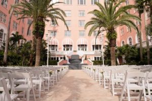Florida Garden Wedding Ceremony in Pink Palace Courtyard, White Folding Chairs | Historic Tampa Bay Wedding Venue The Don CeSar