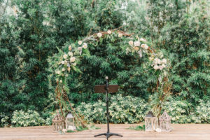 Rustic Wedding Decor and Outdoor Ceremony Details, Wooden Alter with Antique Lanterns, Under Circular Ceremony Arch made of Sticks, Twigs, Leaves, Stems, Ivory Roses, Blush Pink Flowers, White Florals | Tampa Bay Wedding Venue Florida Rustic Barn Weddings