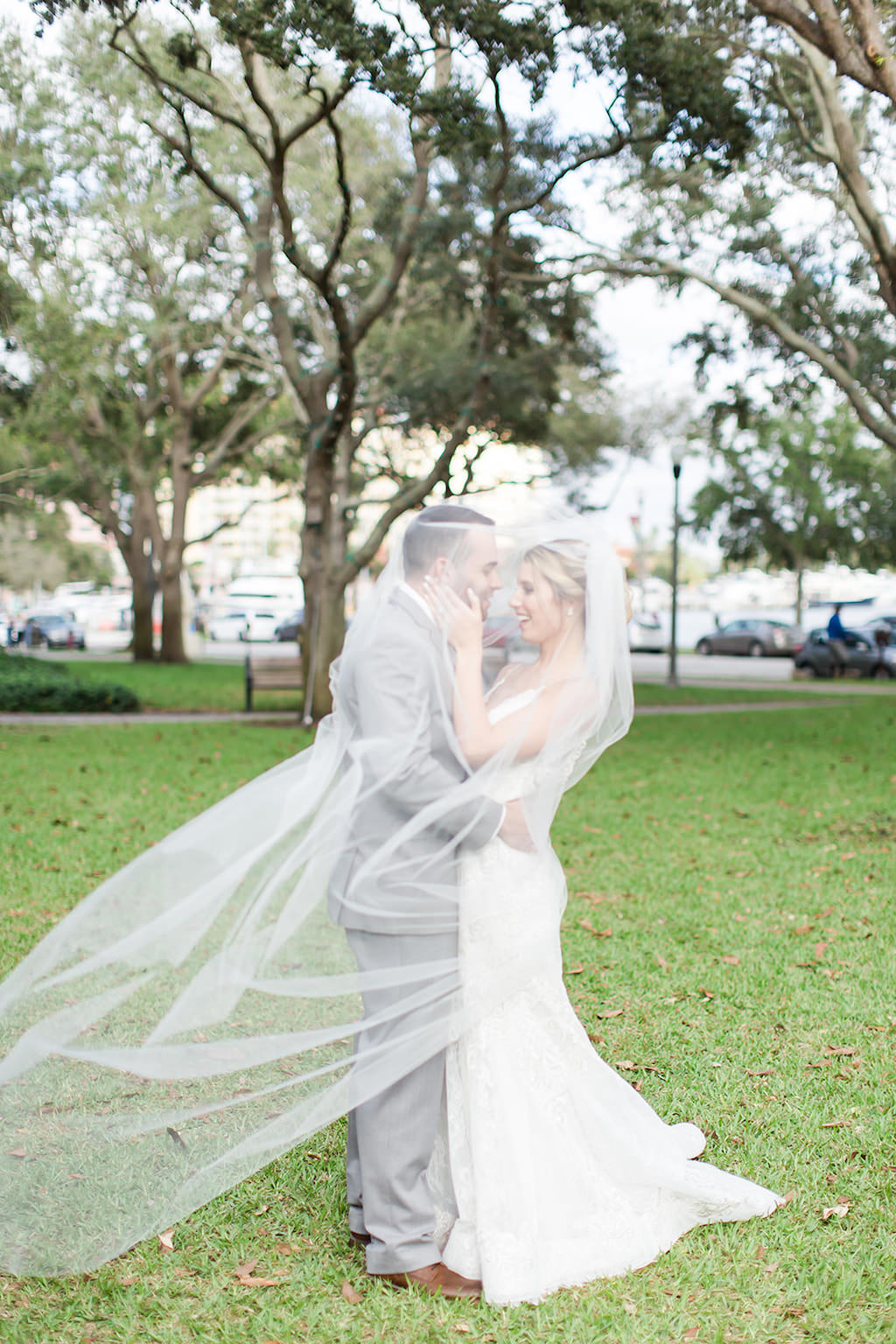 Downtown St. Pete Bride and Groom, Under Veil Blowing in the Wind, Straub Park in St. Petersburg | Tampa Bay Luxury Wedding Photographers Shauna and Jordon Photography