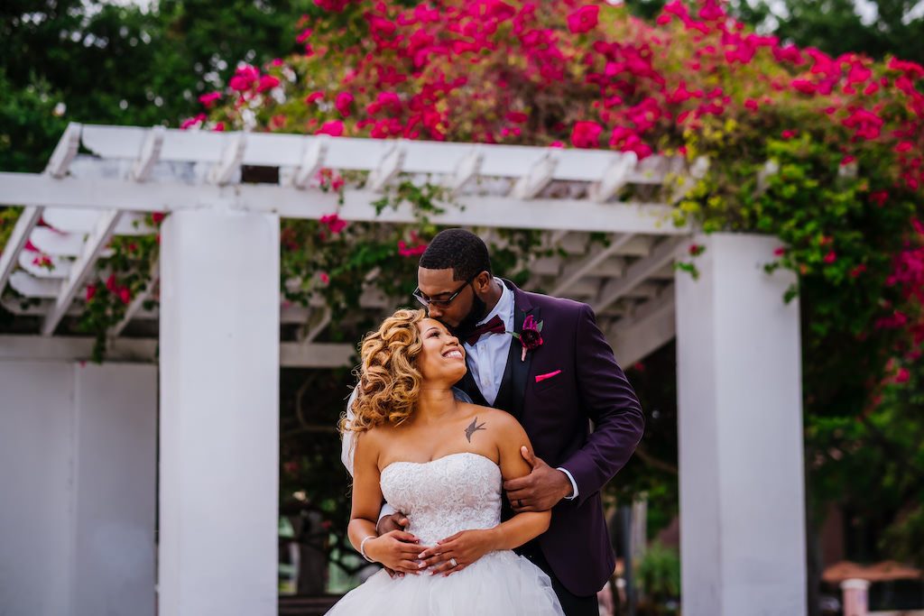 Modern Florida Bride and Groom Wedding Portrait in Straub Park in Downtown St. Pete, Matching Magenta Florals and Groom's Boutonniere, American Basketball Player Davante Gardner