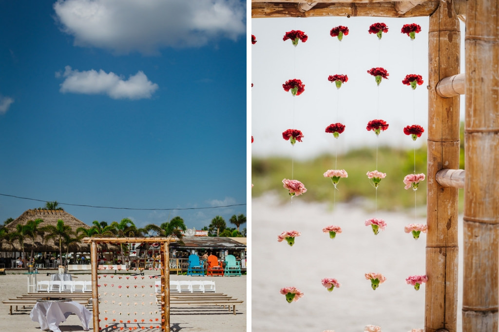 Tropical Waterfront Wedding Ceremony Decor, Bamboo Arch with Hanging Pink and Burgundy Red Carnation Flowers | St. Petersburg Wedding Venue Postcard Inn on the Beach