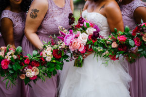 Tampa Bay Bride and Bridesmaids Holding Romantic Textured Floral Bouquet, With Blush Pink Roses, Burgundy Flowers, Hibiscuses, Quartz and Magenta Florals, Dark Greenery