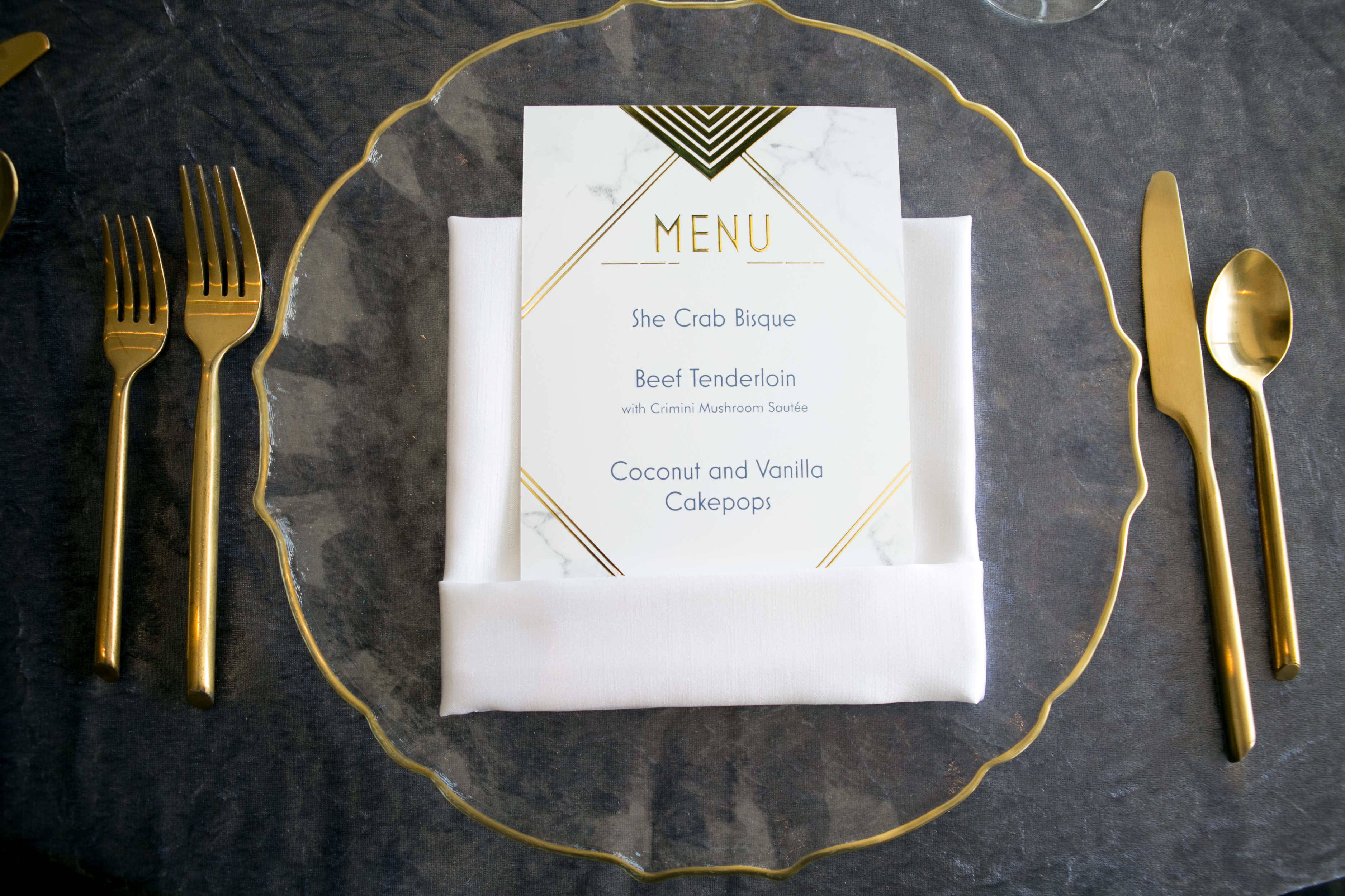 Glass Gold Rimmed Charger Plate and Gold Flatware with Gold Foil White Marble Menu Stationery | Tampa Wedding Rentals Kate Ryan Event Rentals | Wedding Planner John Campbell Weddings | Wedding Photographer Carrie Wildes Photography