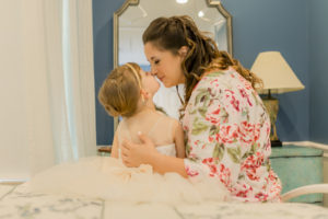 Tampa Bride in Pink Floral Robe and Daughter Flower Girl Sweet Nose to Nose Wedding Portrait | St. Pete Wedding Hair and Makeup LDM Beauty Group
