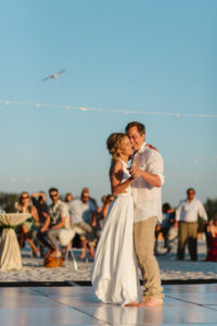 Sarasota Beachfront Bride and Groom Barefoot First Dance Wedding Portrait | Resort at Longboat Key Club Waterfront Beach Wedding Venue