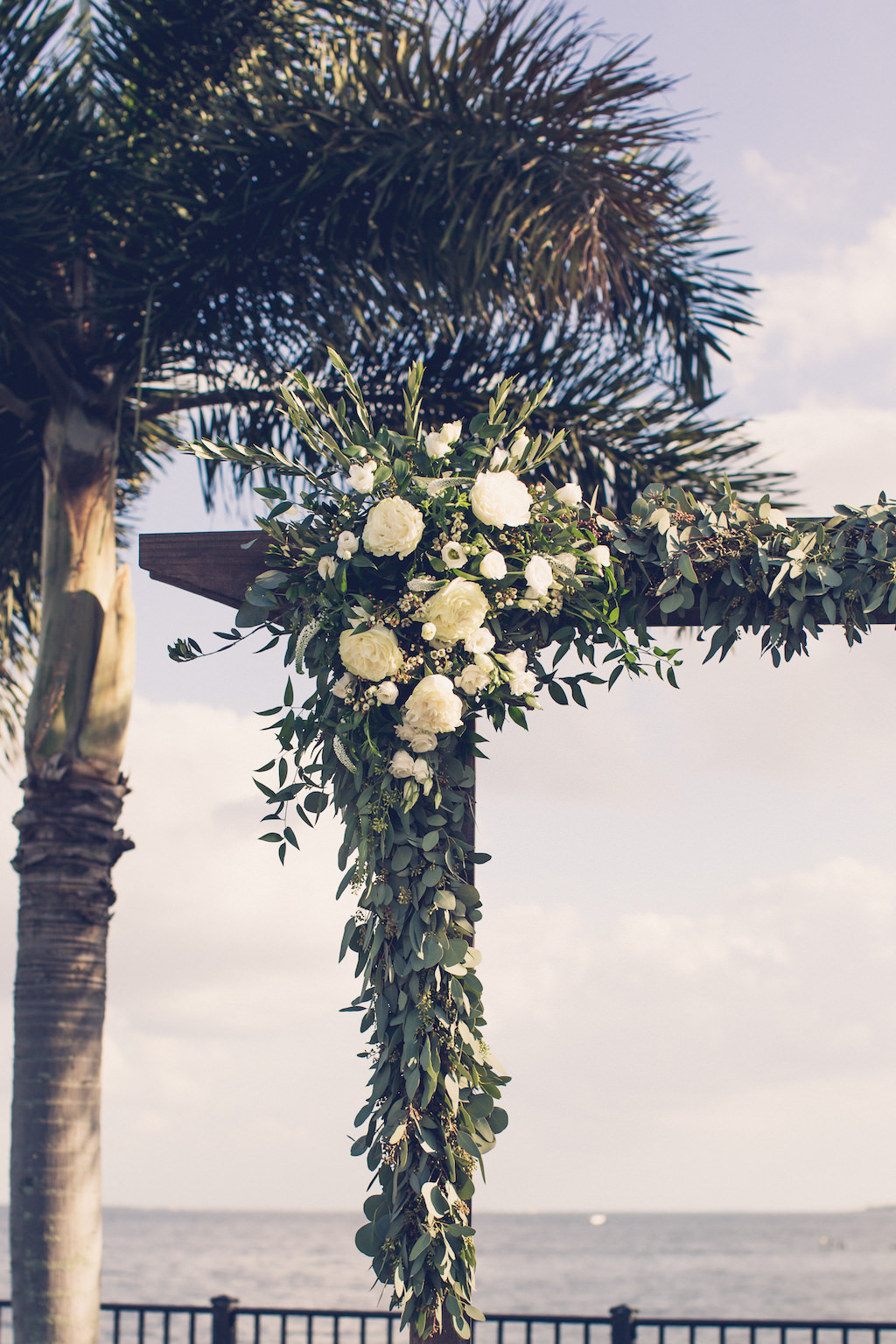 Rustic Chic, Tampa Bay Outdoor Garden Wedding Ceremony Decor Eucalyptus Leaves, White Roses, Greenery Floral Arch | Florida Wedding Photographer Luxe Light Images