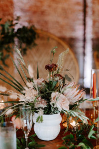 Boho Whimsical Wedding Reception Decor, Small White Vase with Palm Fronds, Blush Pink Roses, King Protea Floral Centerpiece | Tampa Bay Wedding Planner Coastal Coordinating