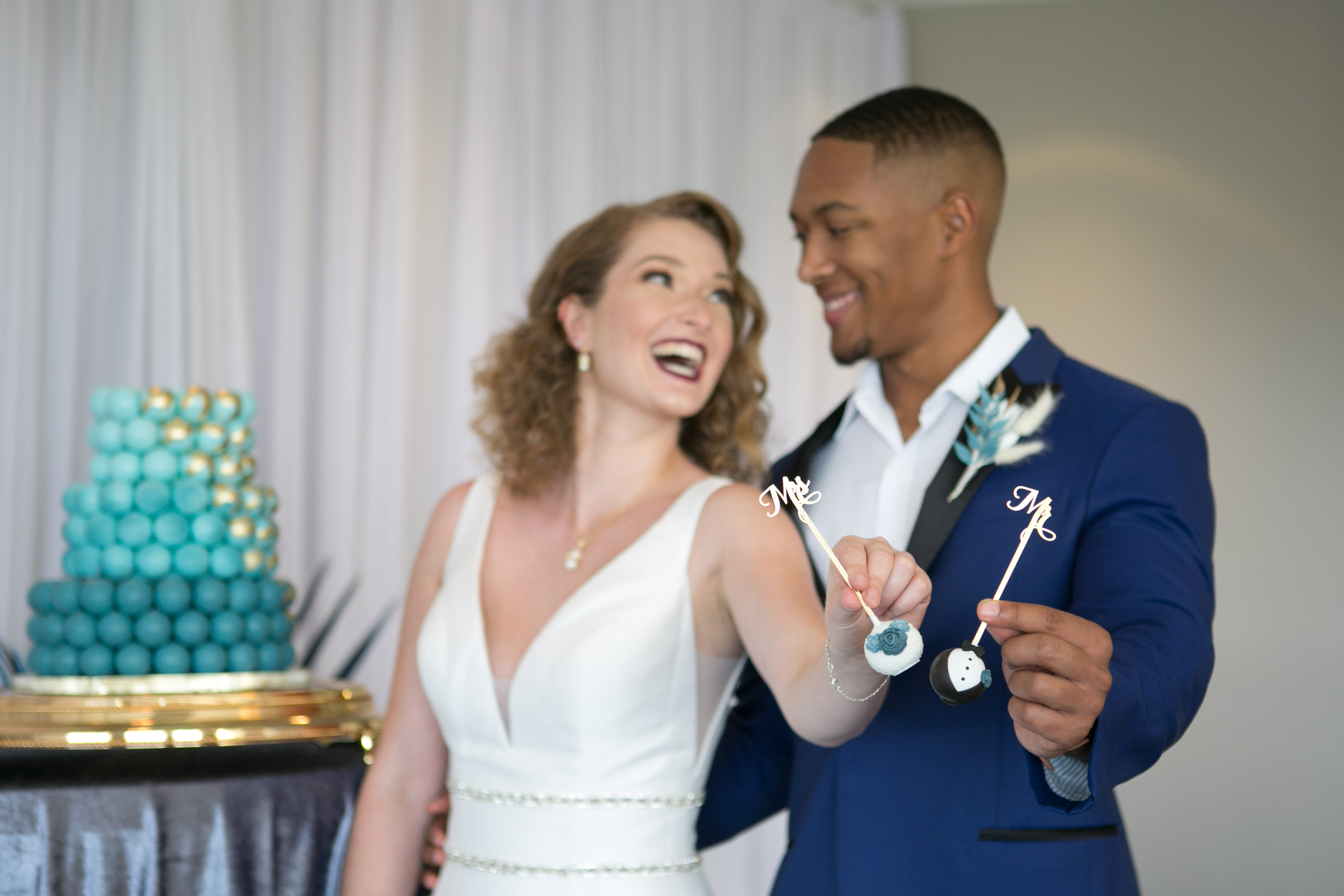 Florida Bride and Groom Holding Unique Groom Tuxedo and Bride Wedding Dress Cake Pop Desserts | Wedding Cake Pop and Desserts Sweetly Dipped Confections | Tampa Wedding Photographer Carrie Wildes Photography