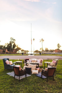 Cocktail Hour Wedding Seating Area with Antique Seats, Couches and Loveseat Outdoor Lounge Area