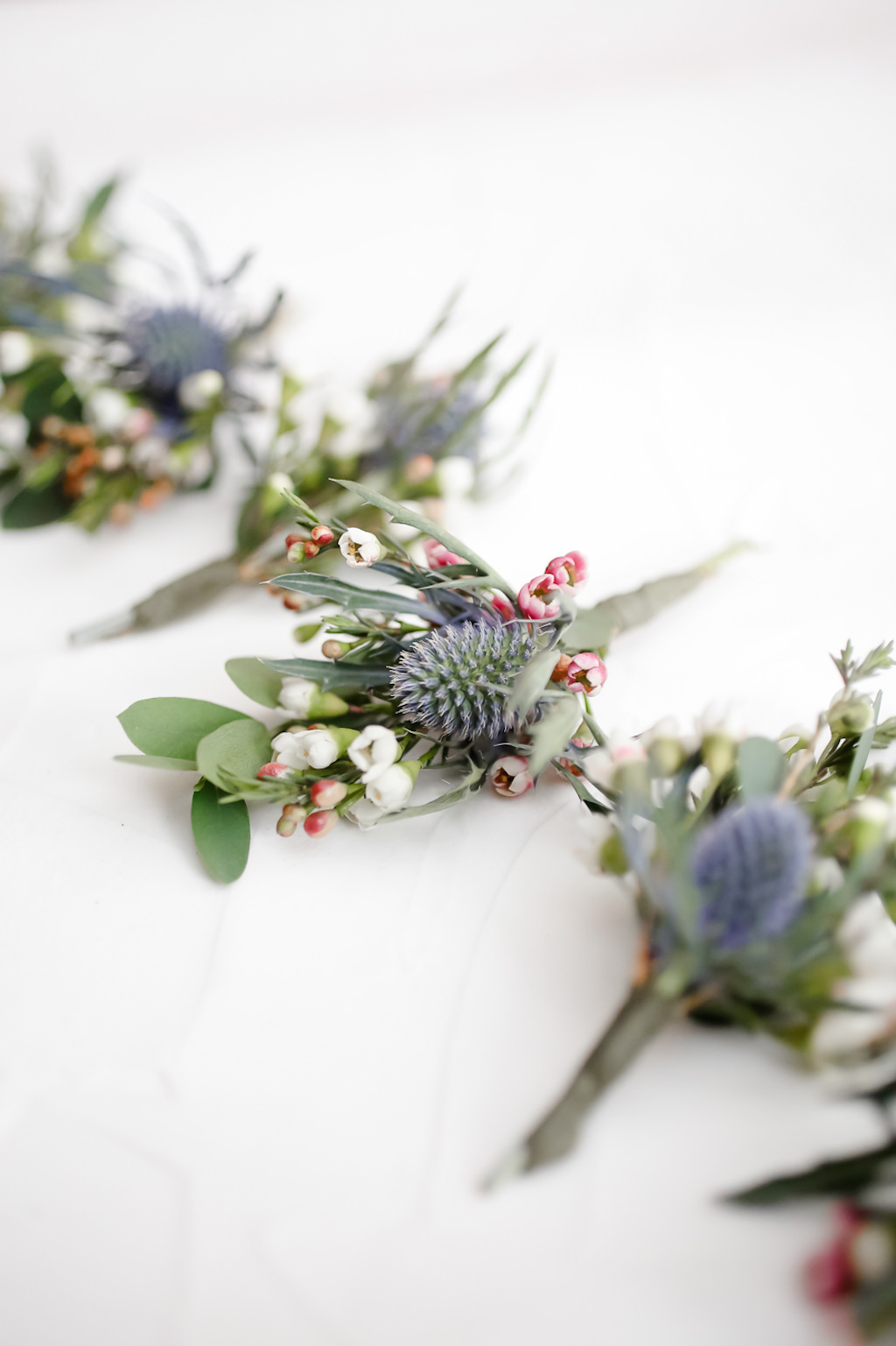 Unique Organic Boho Inspired Greenery and Blue Thistle Groom and Groomsmen Boutonnieres | Tampa Bay Wedding Photographer Lifelong Photography Studio | Wedding Planner Special Moments Event Planning