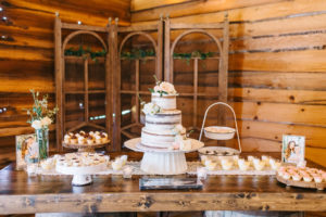 Rustic Inspired Dessert Table with Three Tier Semi Frosted Naked Wedding Cake, Macaroons, Cupcakes | Tampa Bay Wedding Venue Florida Rustic Barn Weddings