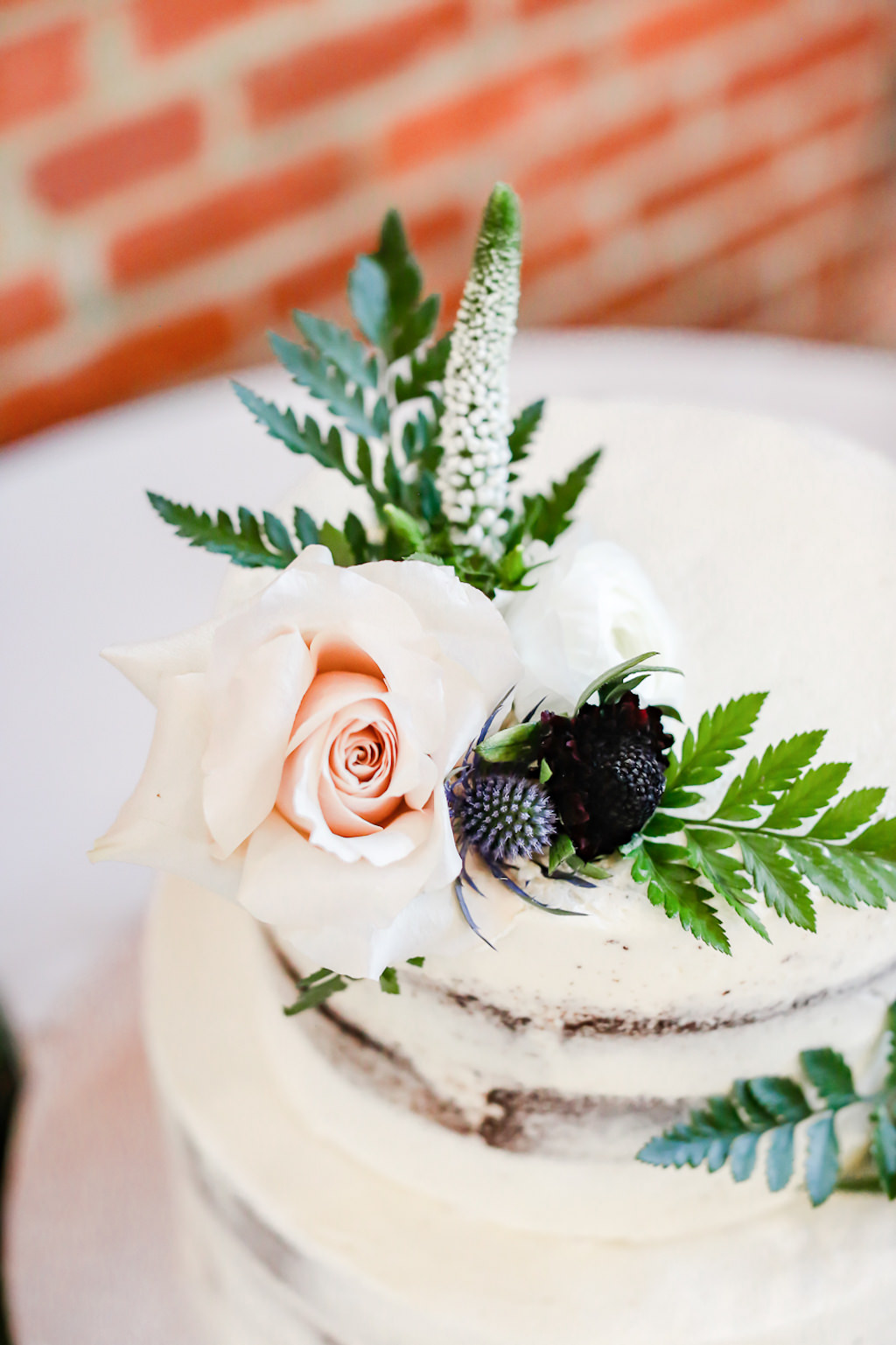 Two Tier Semi Naked White Buttercream Wedding Cake with Blush Pink Rose, Greenery and Blue Thistle Floral Cake Topper | Tampa Bay Wedding Photographer Lifelong Photography Studio | Wedding Planner Special Moments Event Planning