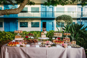 Wedding Reception Dessert Table, Fruit Tarts, Cupcakes, Brownies, Mini Desserts and Two Tier Semi Naked Wedding Cake with a Caramel Drizzle