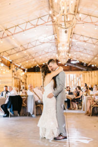 Tampa Bay Bride and Groom First Dance with String Lighting Wedding Reception Portrait | Plant City Outdoor Wedding Venue Florida Rustic Barn Weddings