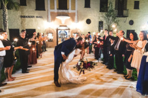 Romantic Dip Kiss Bride and Groom Sparkler Wedding Reception Exit | St. Petersburg Wedding Reception Venue Admiral Farragut Academy
