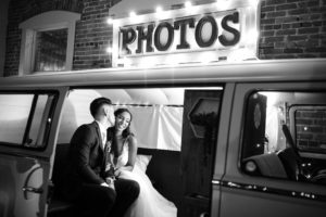 Black and White Intimate Bride and Groom Wedding Portrait in Vintage Photo Booth Bus | Tampa Bay Wedding Photographer Lifelong Photography Studio | Wedding Planner Special Moments Event Planning