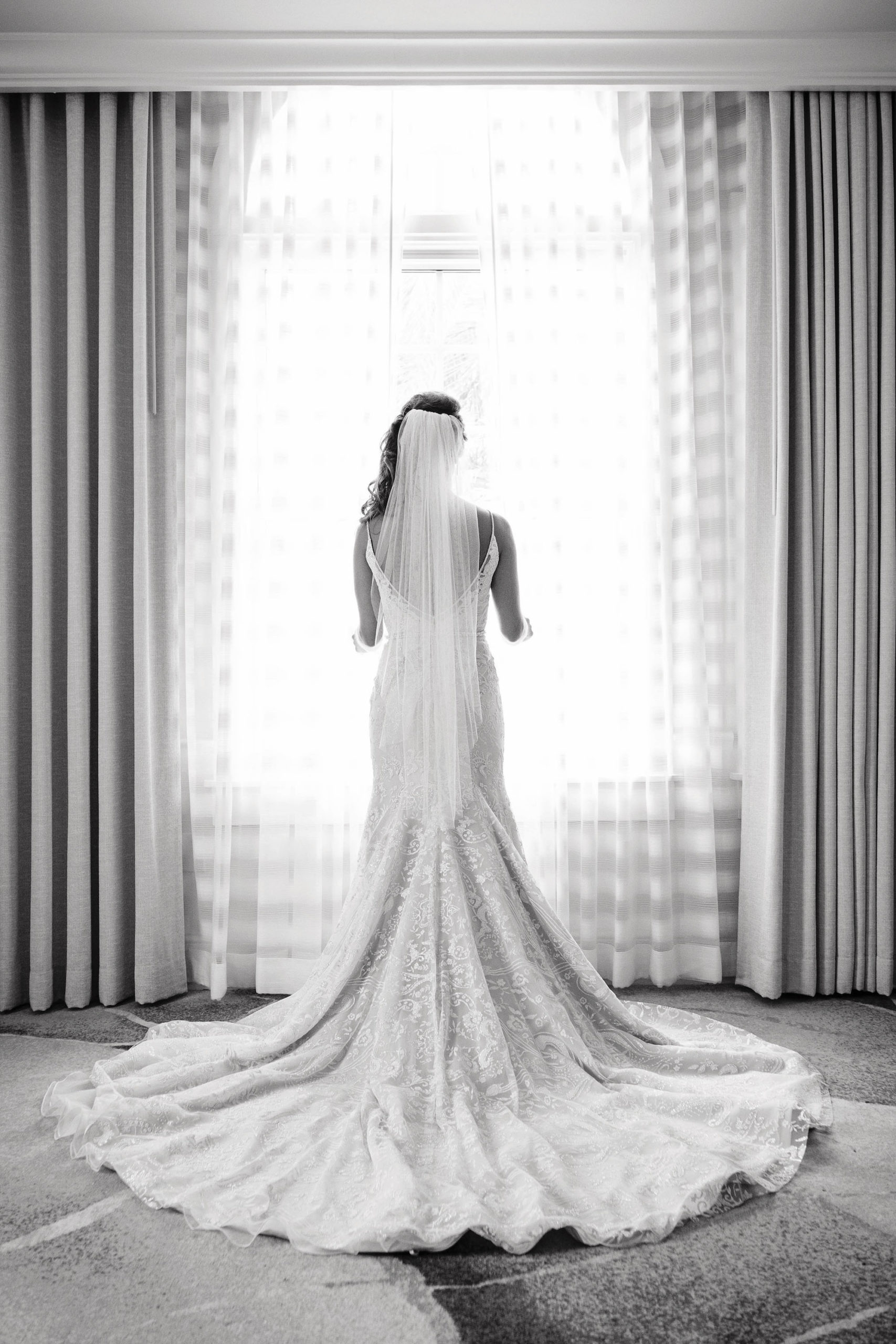 Florida Bridal Portrait Looking Out the Window, Hayley Paige Wedding Dress, Black and White Symmetrical | Tampa Bay Beachfront Resort The Don CeSar Hotel