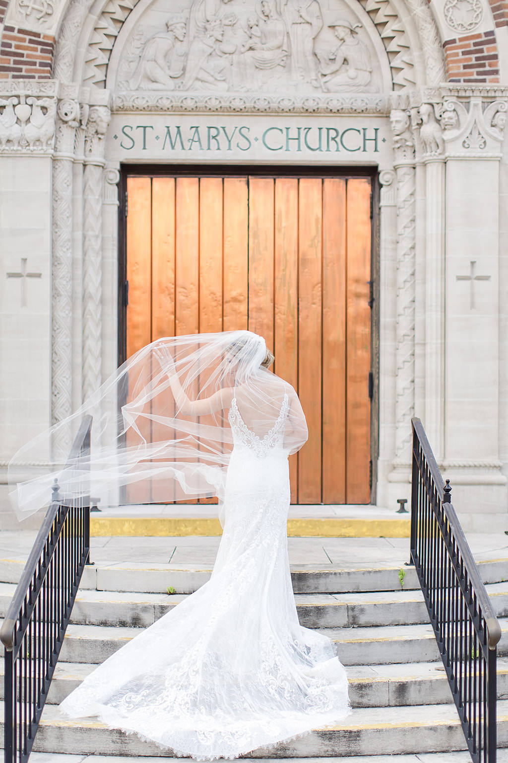 Tampa Bay Bride on Steps of Cathedral, at Saint Mary Our Lady of Grace Church, Allure Veil Blowing in Wind | St. Petersburg Wedding Photographers Shauna and Jordon Photography