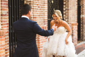 Fun Tampa Bay Bride and Groom Outdoor First Look Wedding Portrait | Wedding Dress Shop Isabel O'Neil Bridal Collection