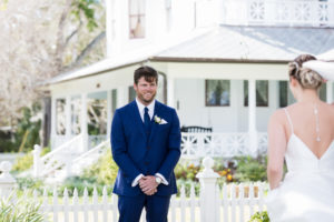 Tampa Bay Groom in Navy Blue Suit and Tie and Bride First Look Wedding Portrait