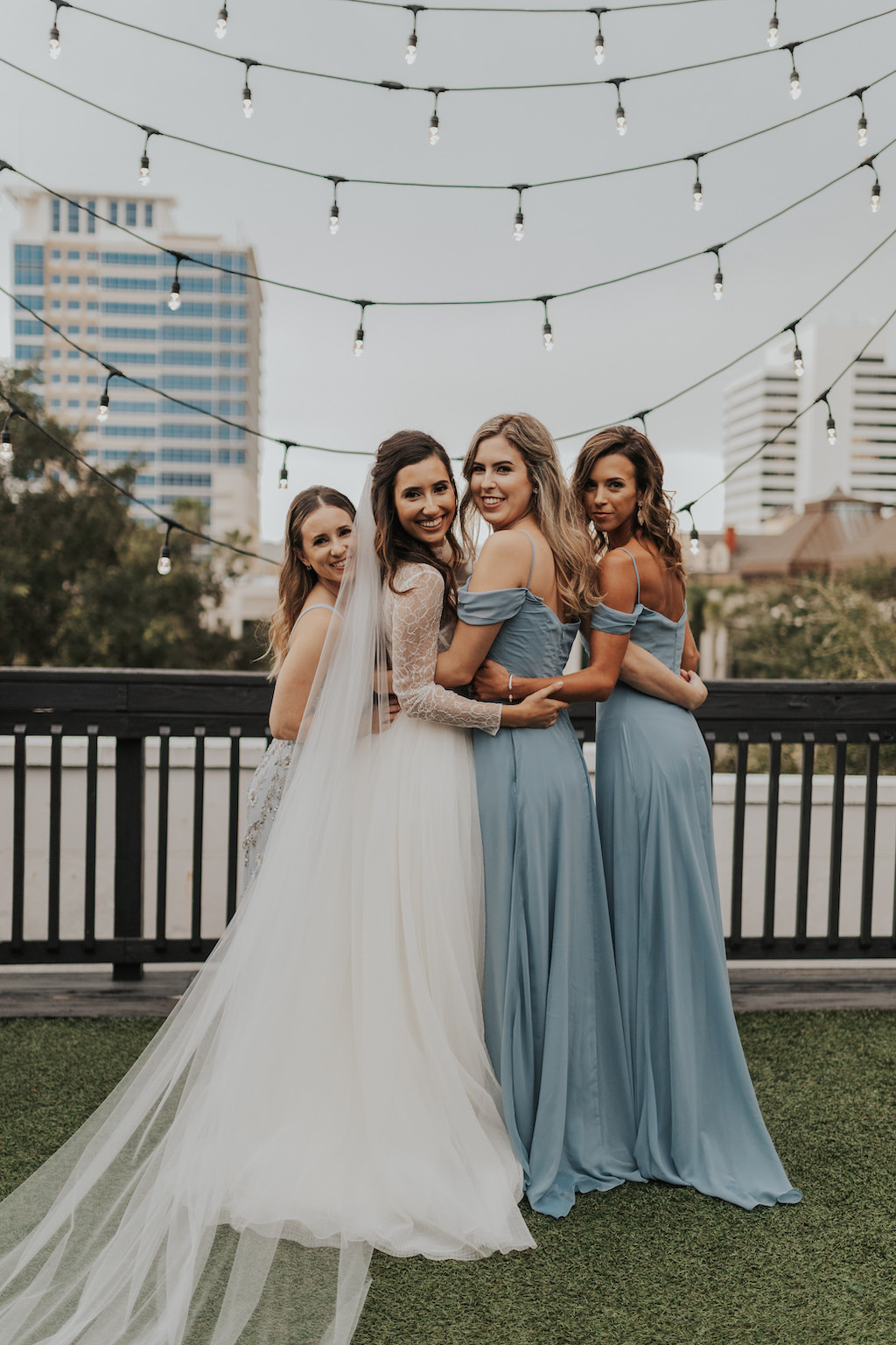 Bride and Bridesmaids in Dusty Blue Off the Shoulder Matching Bridesmaids Dresses | St. Pete Rooftop Wedding Venue Station House