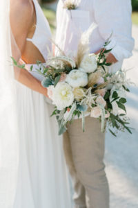 Bride and Groom Wedding Portrait with Bride's Whimsical Wedding Bouquet with Greenery | Resort at Longboat Key Club
