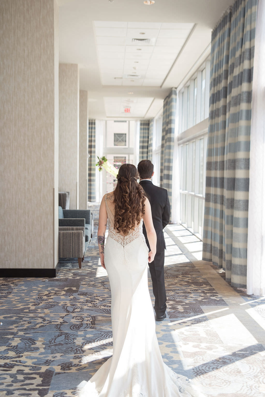 Florida Bride and Groom First Look Wedding Portrait |Tampa Bay Wedding Photographer Kristen Marie Photography | Hotel Wedding Venue Hyatt Place Downtown St. Pete | Wedding Attire Nikki's Glitz and Glam Boutique | Wedding Hair and Makeup LDM Beauty Group