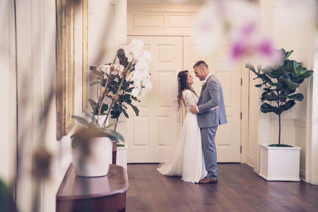 Simple Chic Romantic, South Tampa Bride and Groom First Look Wedding Portrait at Wedding Venue Tampa Yacht Club | Florida Luxury Wedding Photographer Luxe Light Images