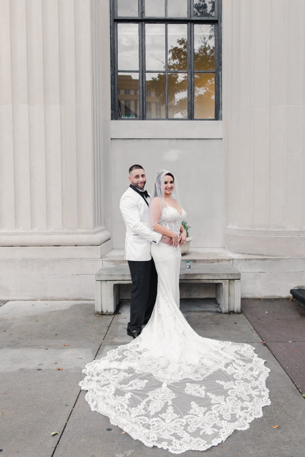 Romantic Groom in White Tuxedo and Bride in Lace and Illusion V Neckline with Spaghetti Straps Wedding Dress with Long Train Portrait