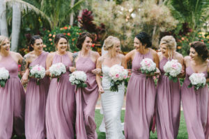 Tropical Modern St. Pete Bride Holding Round Classic White Hydrangeas and Blush Pink Roses Floral Bouquet, Bridesmaids in Mix and Match Mauve Dresses Fun Bridal Party Portrait | Tampa Bay Wedding Photographer Kera Photography | Wedding Dress Shop Truly Forever Bridal