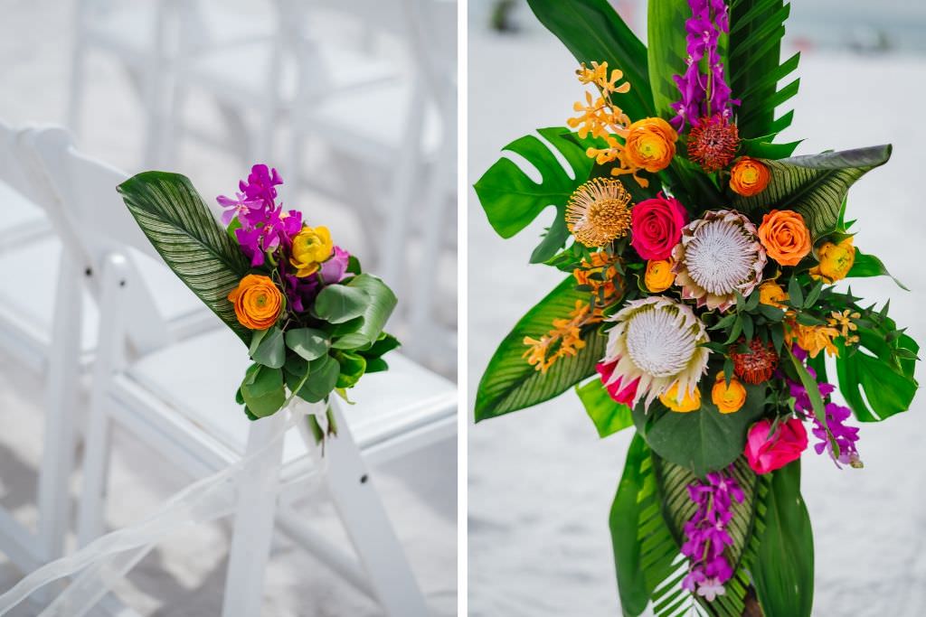 Clearwater Beach Waterfront Tropical Floral Arrangements on Chairs, Monstera Palm Leaves, King Proteas, Orange and Pink Roses, Yellow and Purple Floral Arrangements | Florida Beach Wedding Ceremony Decor Ideas