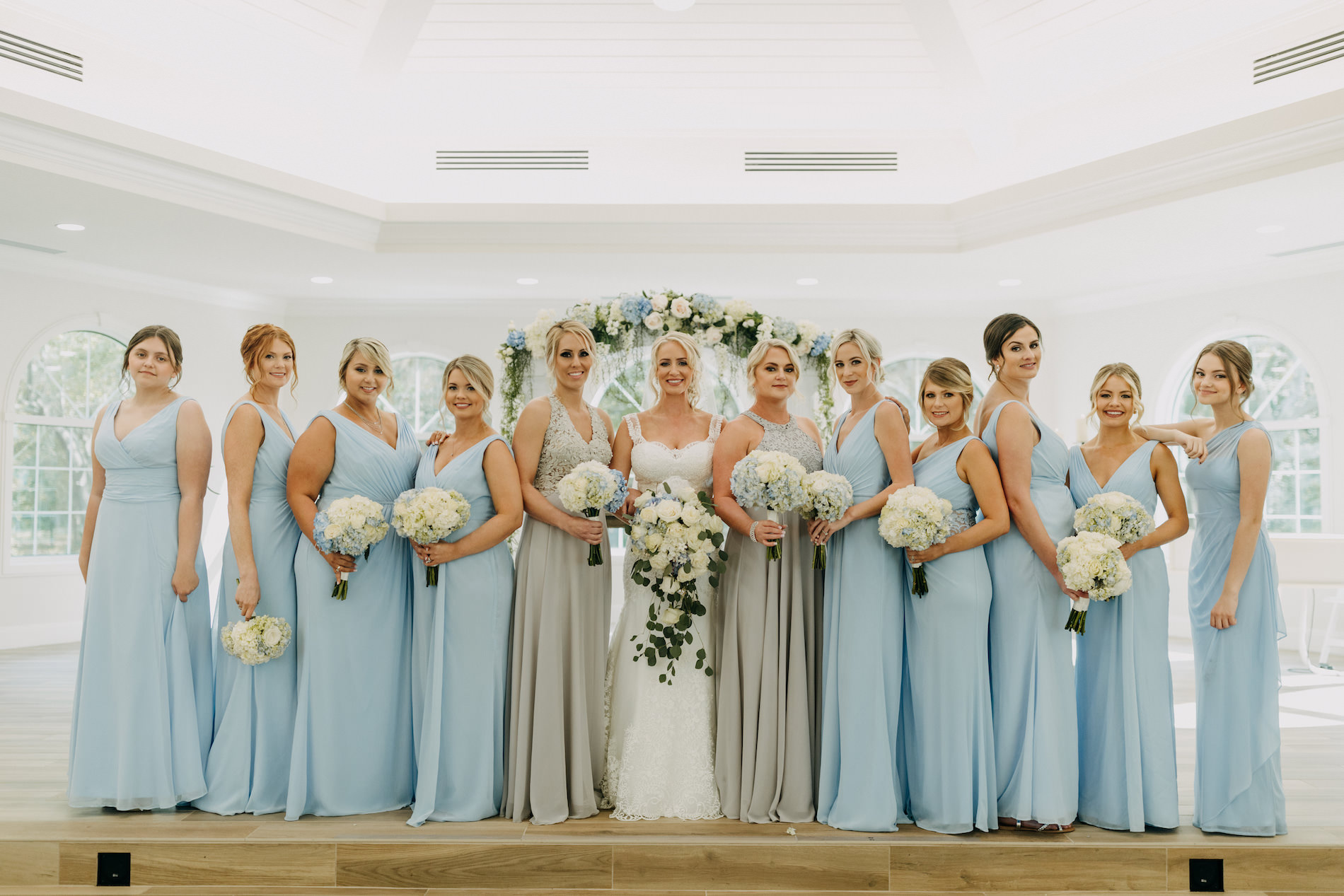 Florida Bride and Bridesmaids in Mix and Match Powder Blue and Silver Dresses Holding White Hydrangeas Floral Bouquets | Traditional Church Wedding Ceremony Venue Harborside Chapel