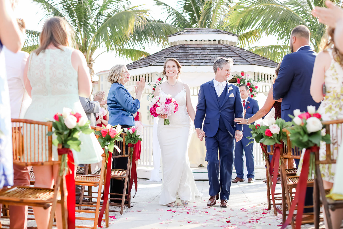Tropical Romantic Florida Bride and Groom Recessional Wedding Ceremony Portrait | Tampa Bay Wedding Photographer Lifelong Photography Studios | St. Pete Waterfront Wedding Venue Isla Del Sol Yacht and Country Club